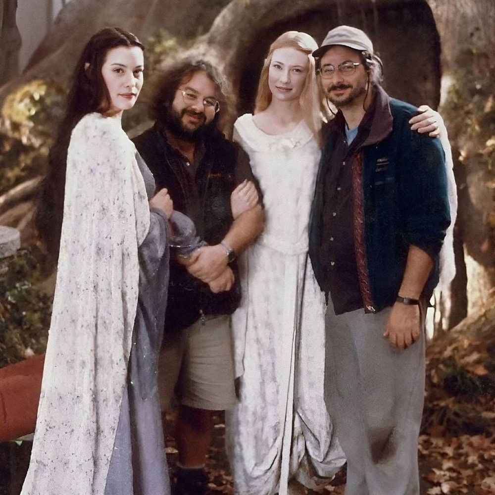 behind the scenes of LOTR: Peter Jackson and Andrew Lesnie (both dressed regular) with the Liv Tyler and Cate Blanchett (both dressed as elves)