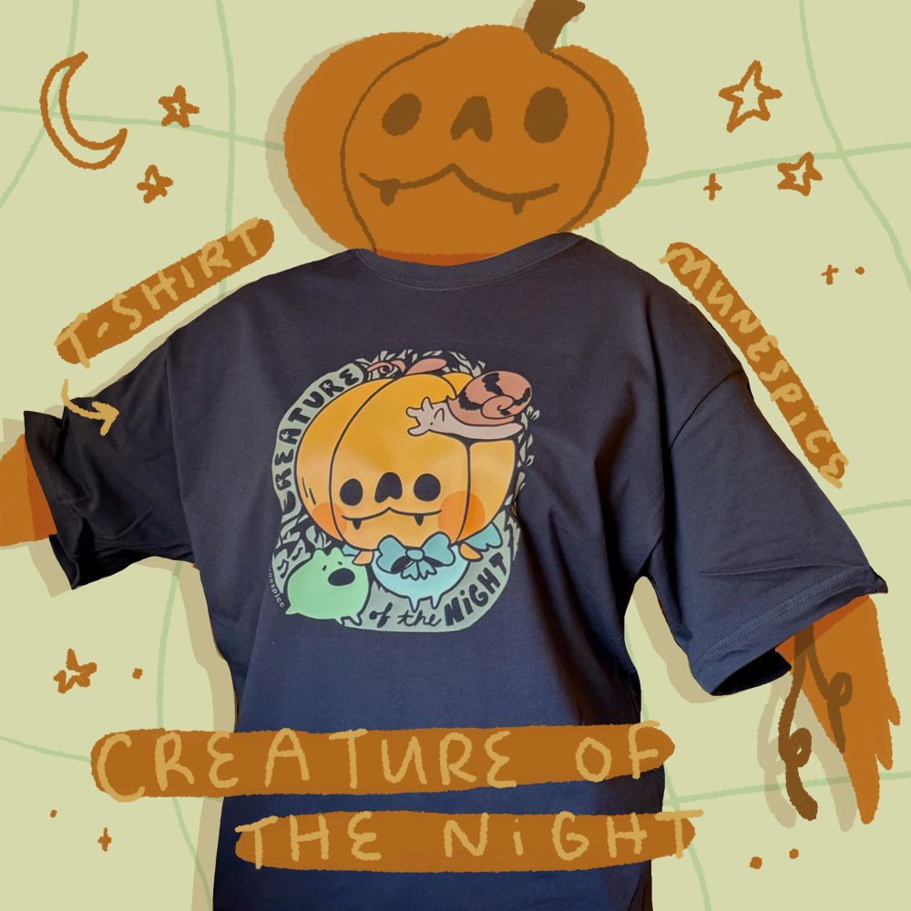 A gray t-shirt that says creature of the night 