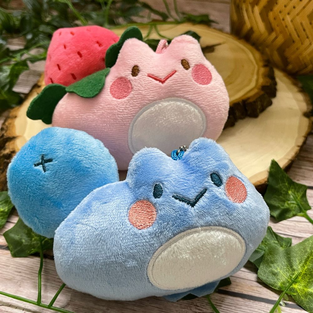 Strawberry and blueberry frog keychain plushies