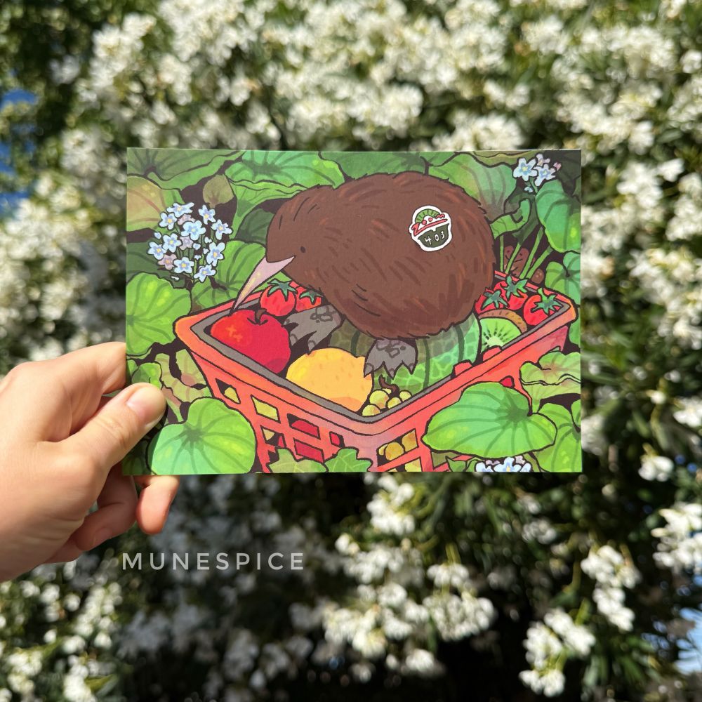 A print of a kiwi bird sitting on basket of fruit