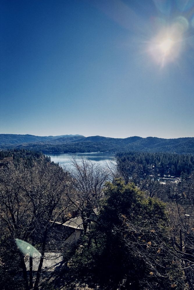 View of Lake Arrowhead with trees surrounding it. 