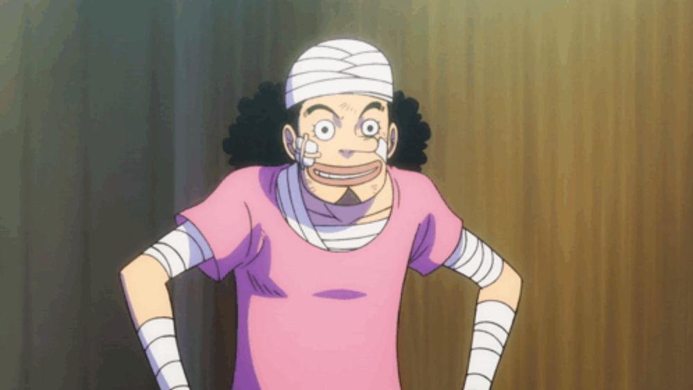 a cartoon character with bandages on his head and arms is wearing a pink shirt