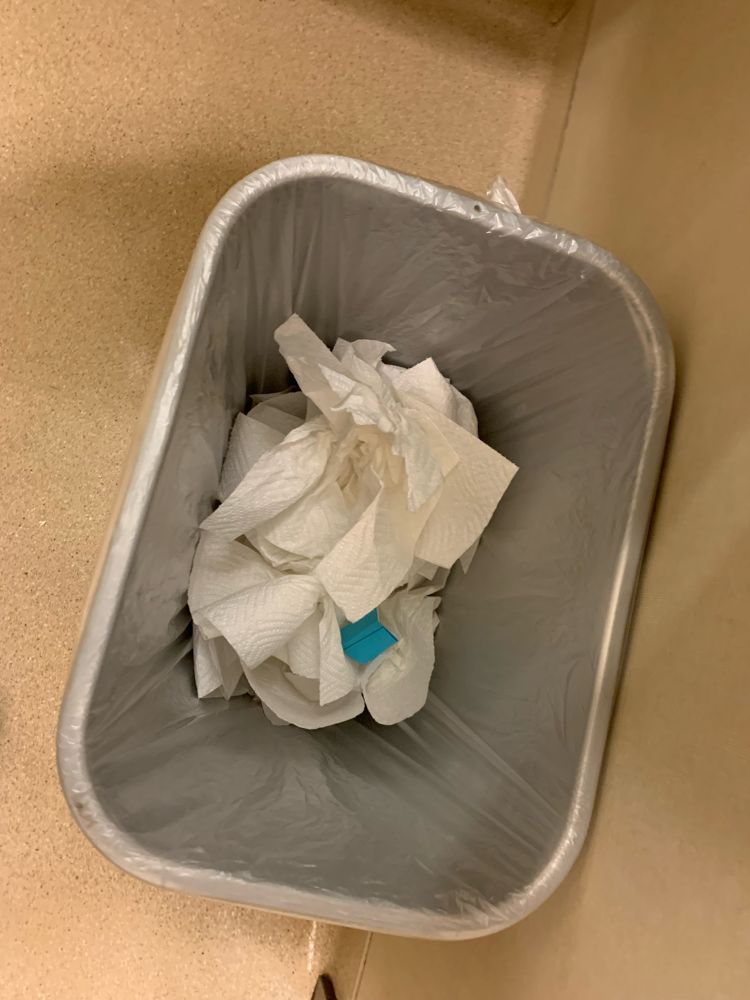 It’s a picture of trash in a trash can. A cursed aesthetic.