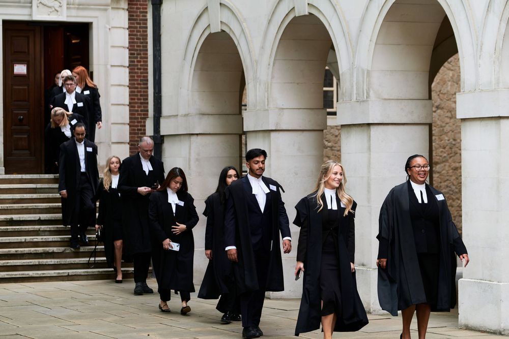 Students leaving The Inner Temple Hall to go to Temple Church to attend the the Call to the Bar ceremony.