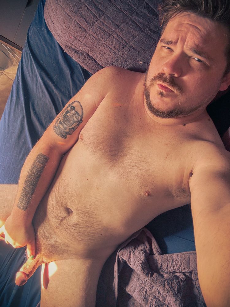 Selfie laying naked in bed while sporting morning wood 