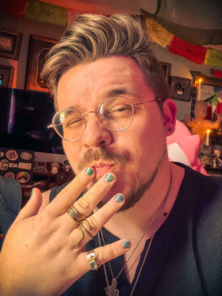 Showing off my newly painted green/purple nails