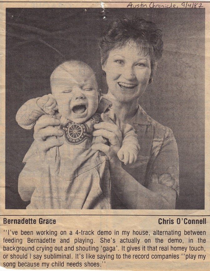 Newspaper clipping of a woman holding a crying baby