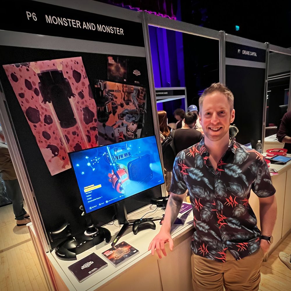 Jay Britton, aka the voice of Red Eddie, looking cool while posing next to the Monster and Monster booth at the Interactive Futures Exhibition in Royal Leamington Spa.
