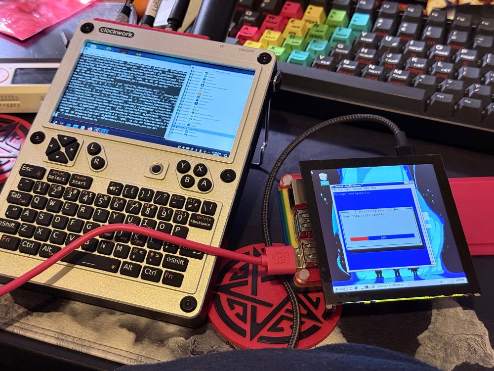 A uconsole right next to a rpi5 with the thin case