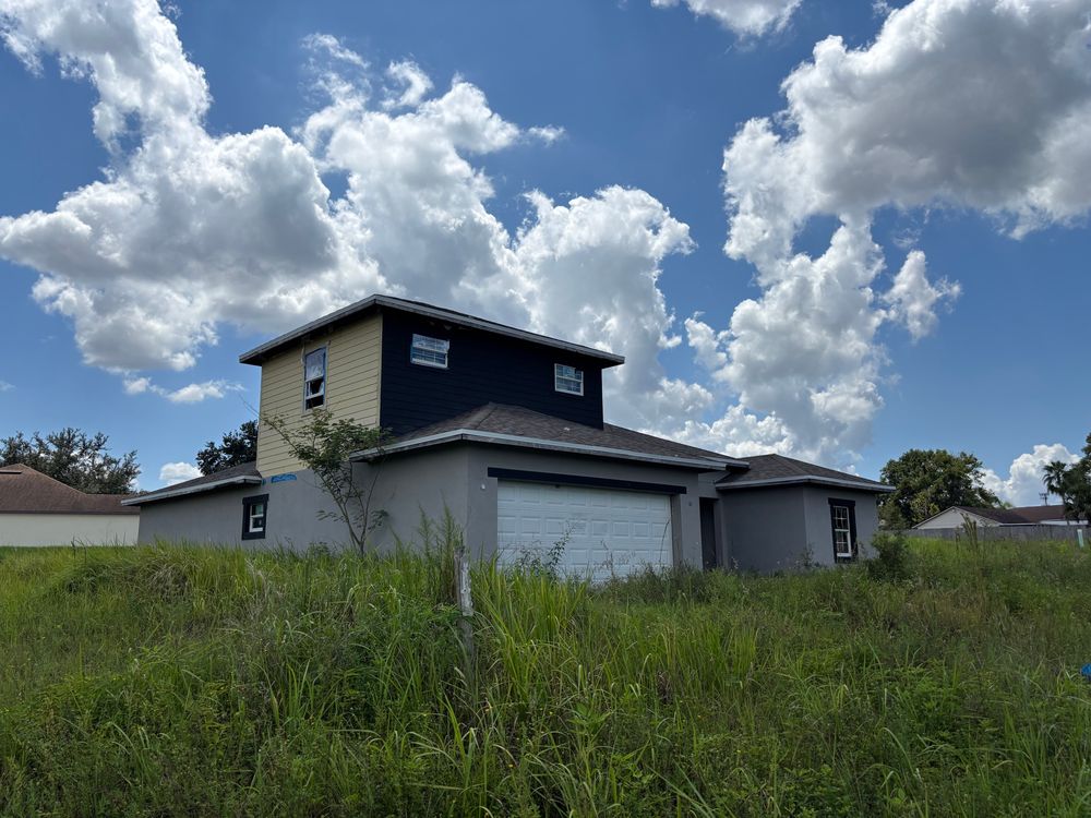 Abandoned, incomplete neighborhood with derelict infrastructure and model homes. Project collapsed sometime after 2017.
