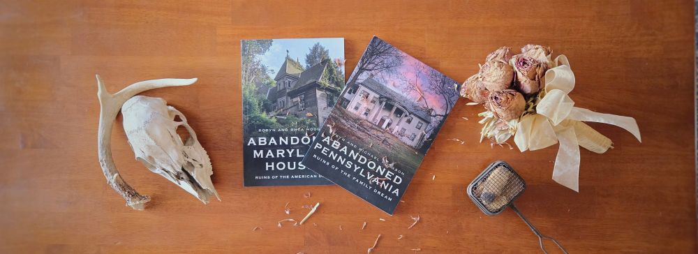 These are two books of photography and selective histories and research on abandonment, written by my wife and I. The first one is "Abandoned Pennsylvania: Ruins of the Family Dream." This one came out before I came out and changed my name. The second one is "Abandoned Maryland Houses: Ruins of the American Dream." The second came out after I came out. We are both working on memoirs and researching for future publications.