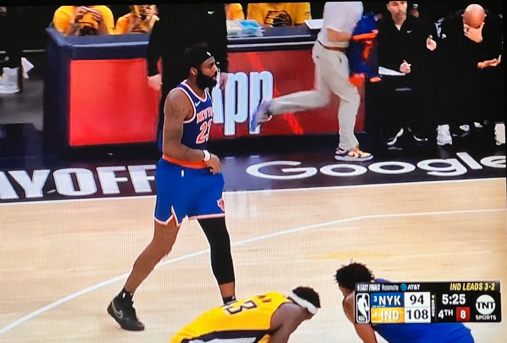 Screen grab of the Knicks/Pacers game tonight with 5:25 left on the clock. The Pacers were up 108 -94. In the upper corner, Rick Brunson can be seen leaning over with his right hand over his face. 