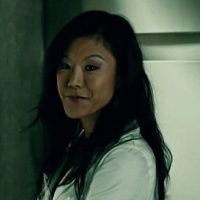 Beverly Katz from Hannibal, a Korean American actress with long black hair and smirking smile.