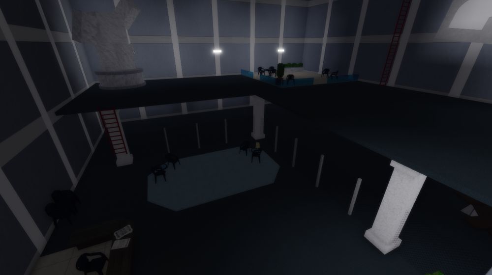 A Roblox building. Inside is a front desk, pillars, a fenced off area, a little lobby, a ladder, and a seating area on the second floor. There is also a statue, and in the corner is a broken concrete block with a 219 sign.