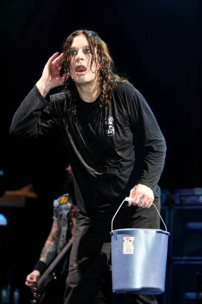 Ozzy Osborne, holding a bucket of water he's about to throw on the audience and holding a hand to his ear after telling the audience to "let me see your fuckin' hands!" for the 30th time that night.