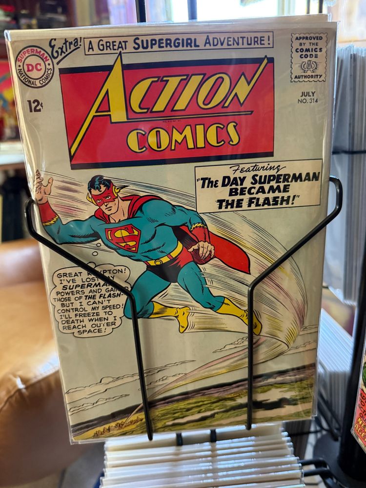 Action Comics 314 cover showing Superman flying but with Flash's powers and none of his own and waring his normal costume with only parts of Flash's costume added to it and I don't know how he's flying if he's lost his powers of flight and only has Flash's ground-based superspeed powers and anyway, gotta love '50s and '60s comic covers.