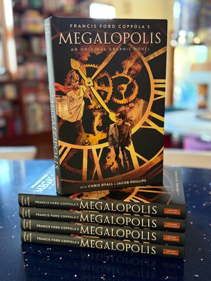 5 copies of the upcoming Megalopolis graphic novel with cover art featuring the two lead characters by Jacob Phillips