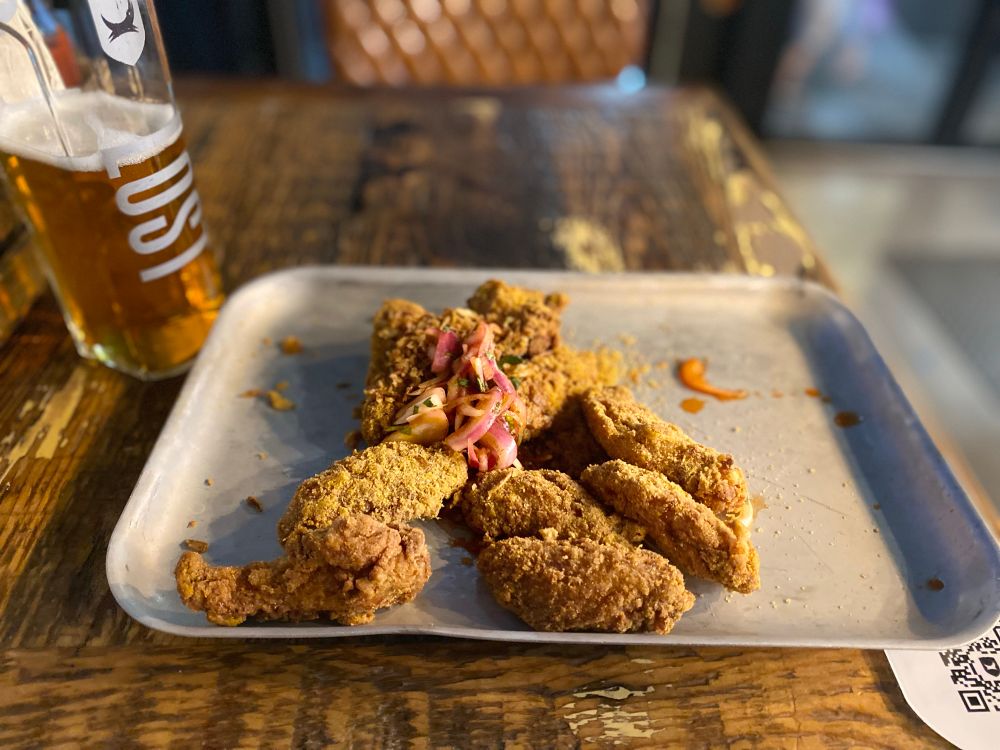 A tray of satay chicken wings with sriracha mayo at a Brewdog pub (I don’t know where the sriracha is but they’re amazing nonetheless)