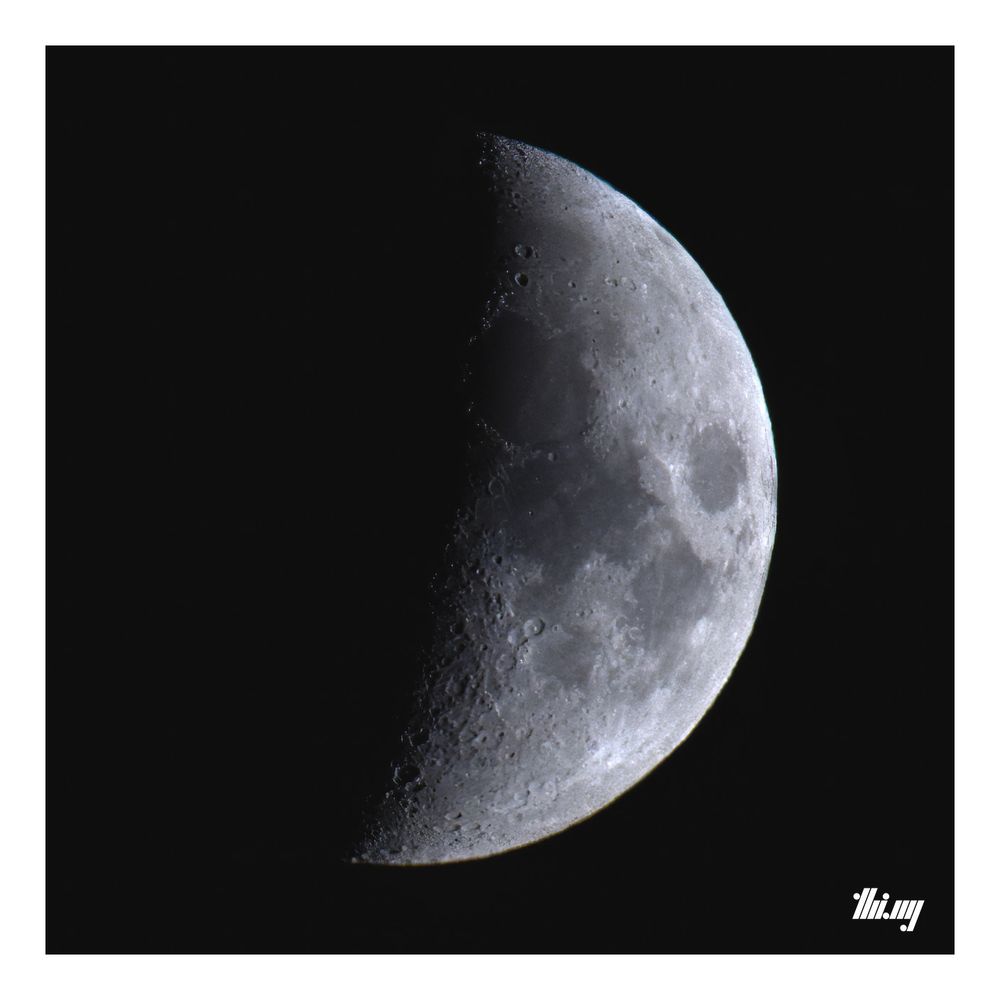 Photo of the waxing crescent moon with Mare Serenitatis, Mare Tranquillitatis and many smaller craters clearly visible...