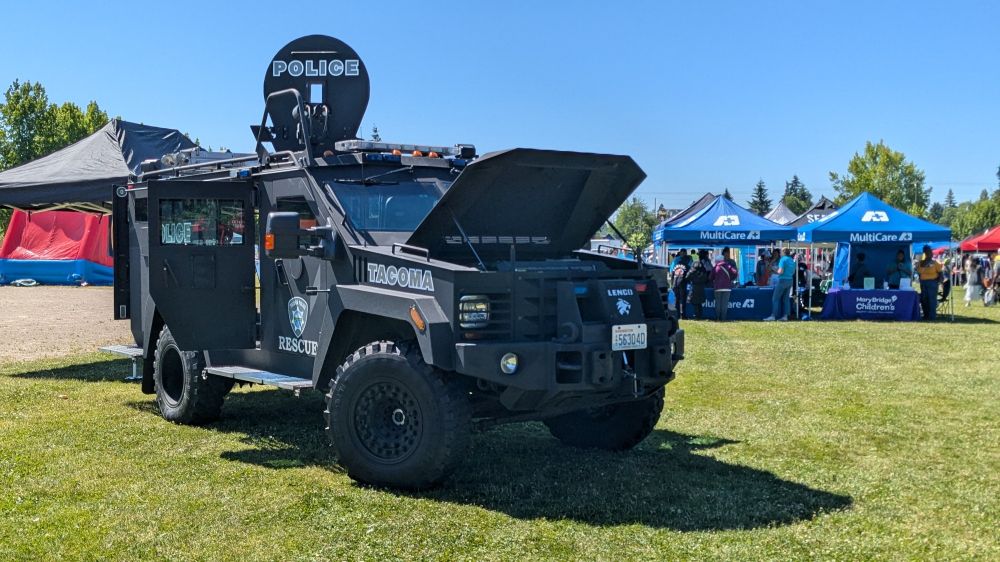 An enormous Tacoma Police Department  Humvee/tank parked for display/exploration at the Juneteenth Celebration.