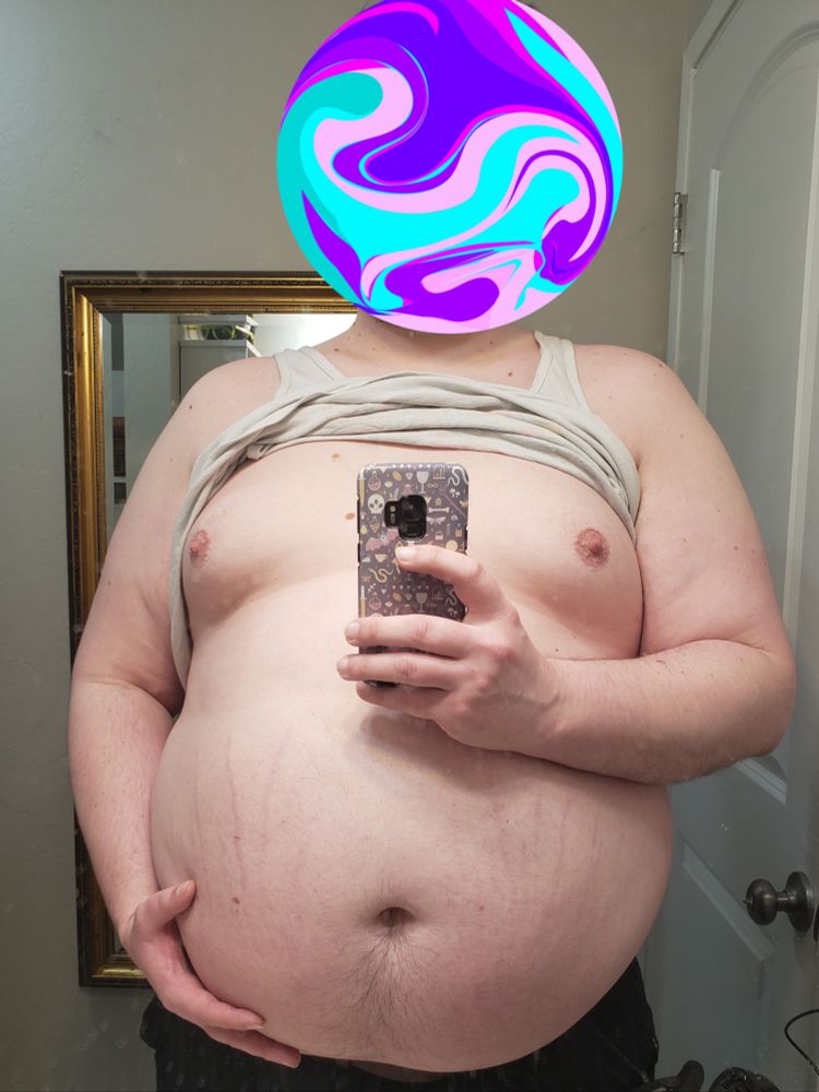 Robogut with its shirt pulled up, exposing its fat tummy and moobs