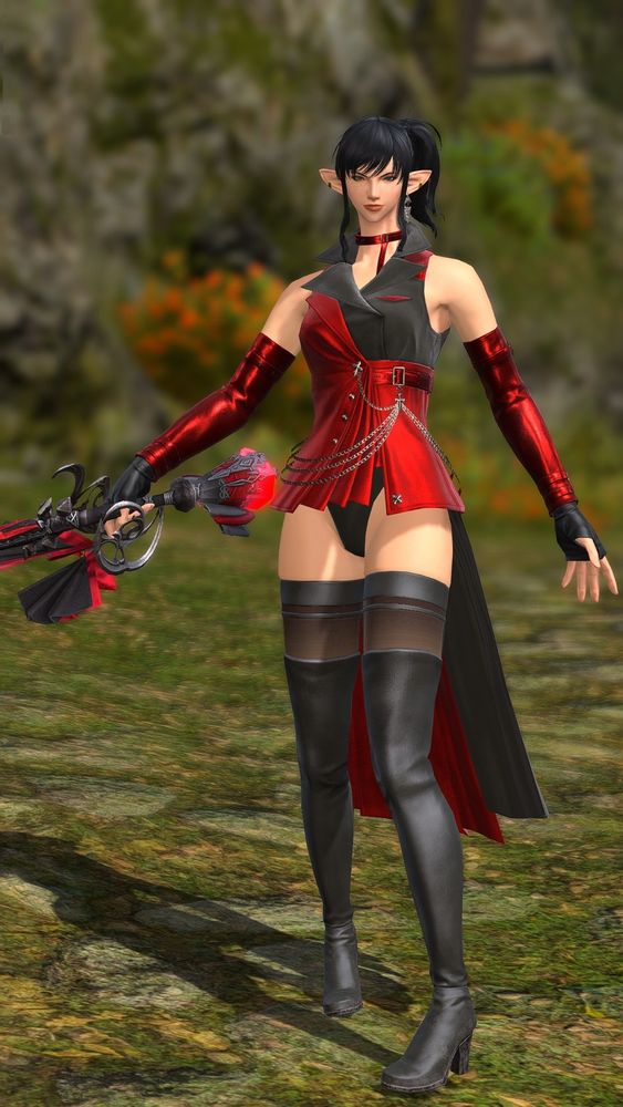 Female elezen in a red and black outfit with her sword drawn