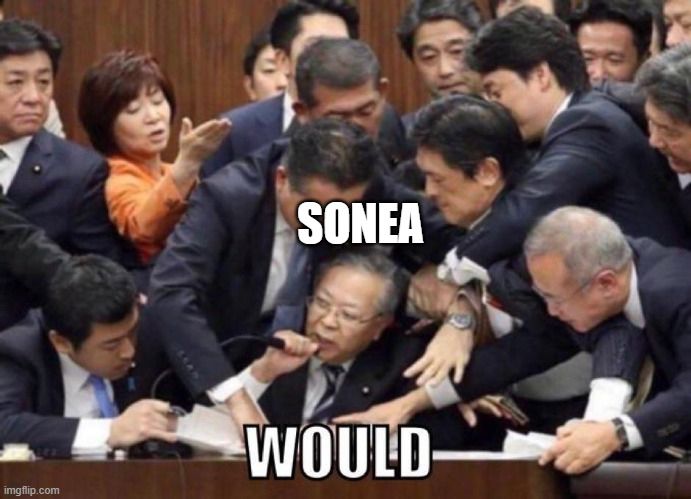 An image of an old politician taking a microphone while a lot of people is trying to take it away, with the word "would"