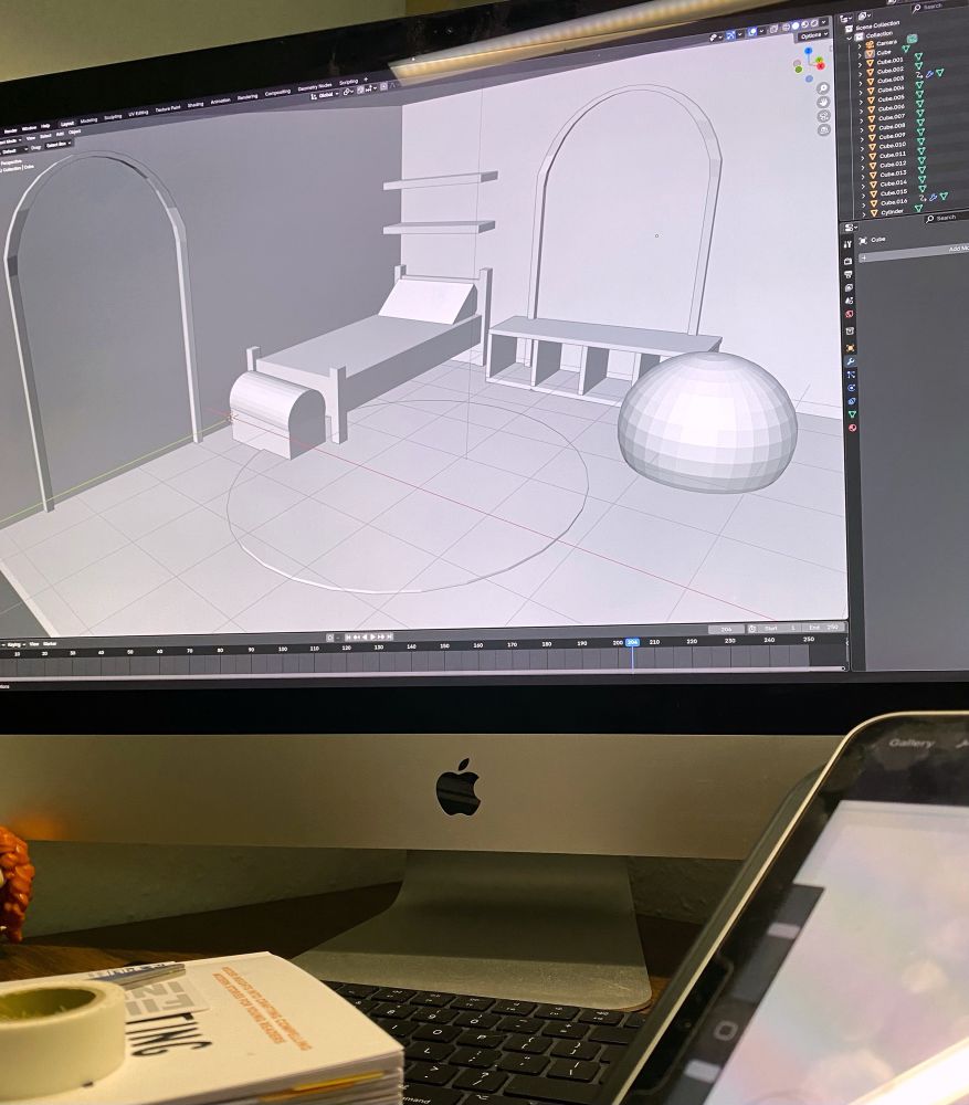 photo of my computer screen showing a scene in blender with simple shaped bed, toy truck, some shelves and some basic shapes for doors and a window