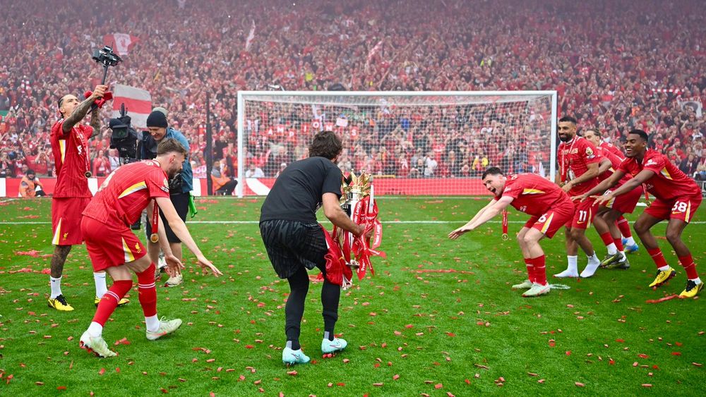 Alisson with the Premier League trophy.
