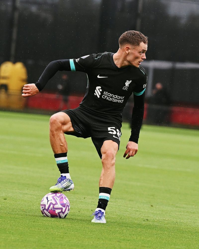 Florian Wirtz with the ball playing for Liverpool against Stoke City at the AXA Training Centre