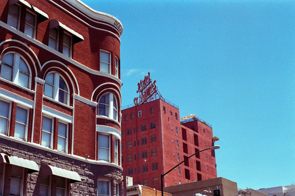 A film photo of red brick buildings in San Diego. 