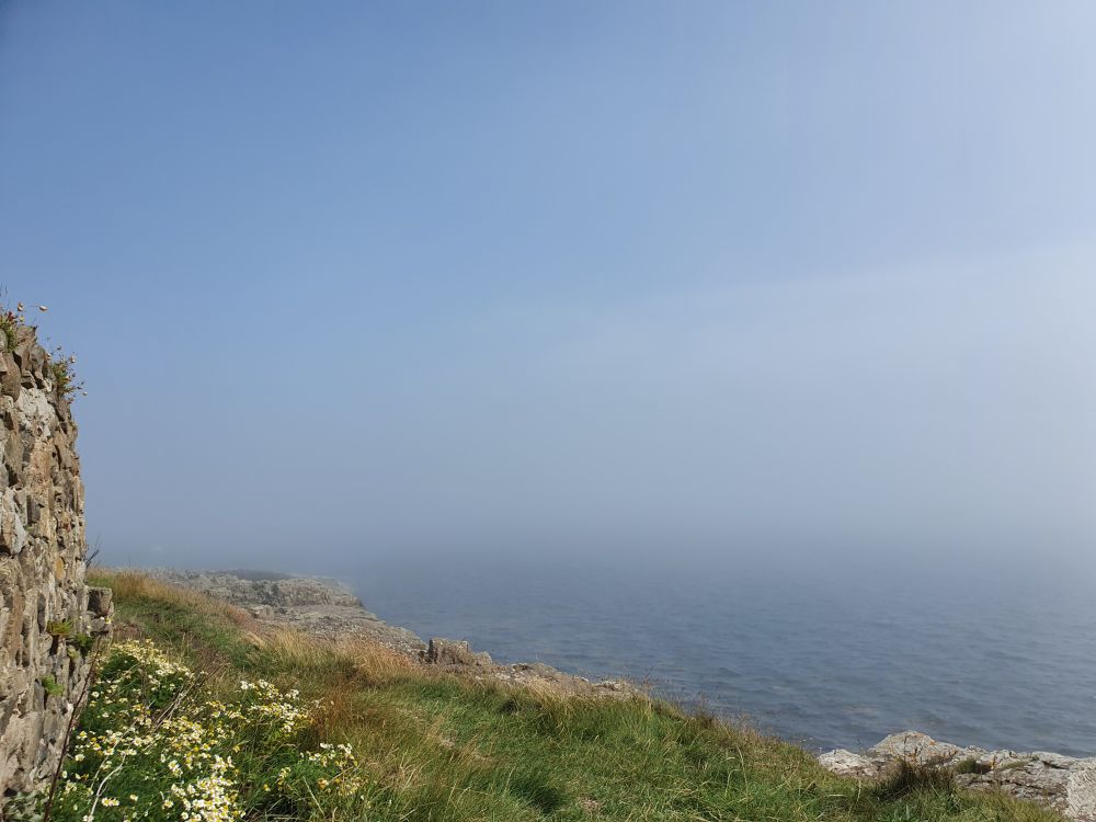 Same view but fishing boats have vanished into the sea fret