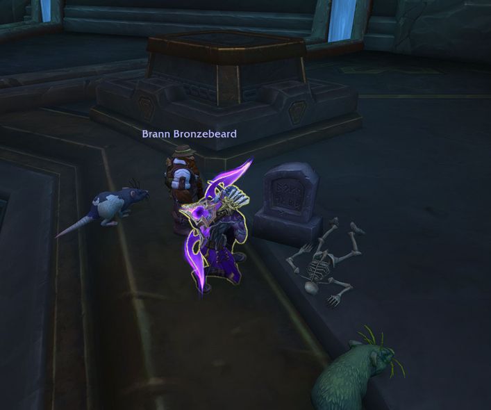 warcraft hunter kneeling in front of gravestone in delve