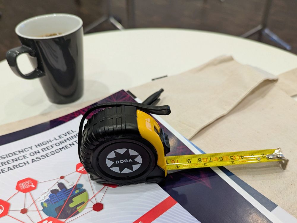 DORA (San Francisco Declaration On 
Research Assessment) branded tape measure given out at the EU Presidency High-Level Conference on Reforming Research Assessment in Copenhagen.