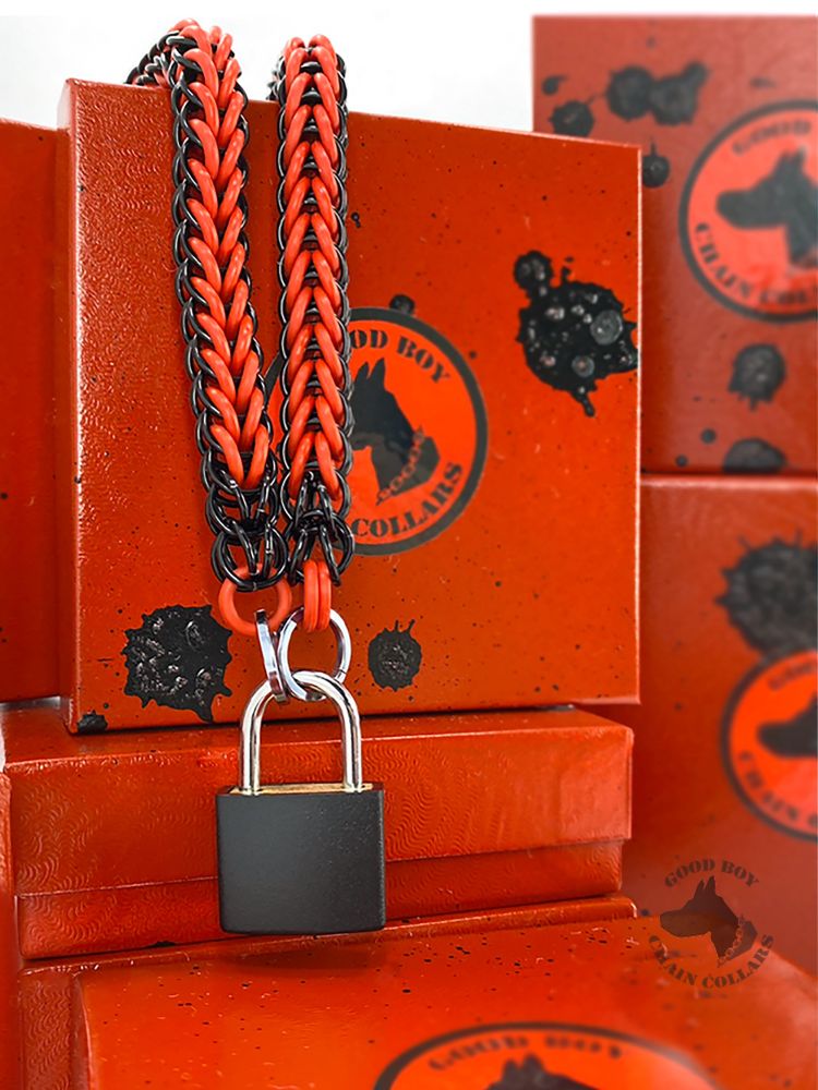 A fire red chain collar draped over hand painted red boxes. This is sold by Good Boy Chain Collar on Etsy.
