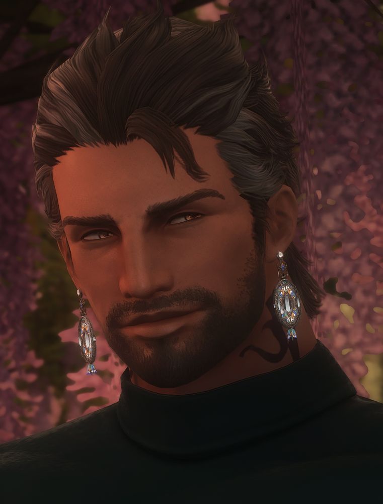 A set of screenshots of my oc, Krieg. He is a brown Highlander Hyur with amber eyes and brown hair that has grey streaks. He bears Archon marks on his neck.

In the photos he is wearing a dark turtleneck and different sets of earrings.

In this image, he is wearing a set of earrings that look like stained glass. They are large dangling ovals with a flower-type piece that hangs at the bottom. In the center of the oval, it opens up to showcase a white crystal.