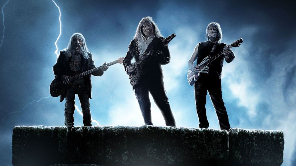 Spoof rock band spinal tap stand atop a fake Stonehenge in a publicity picture for the film 'Spinal Tap II: The End Continues'.