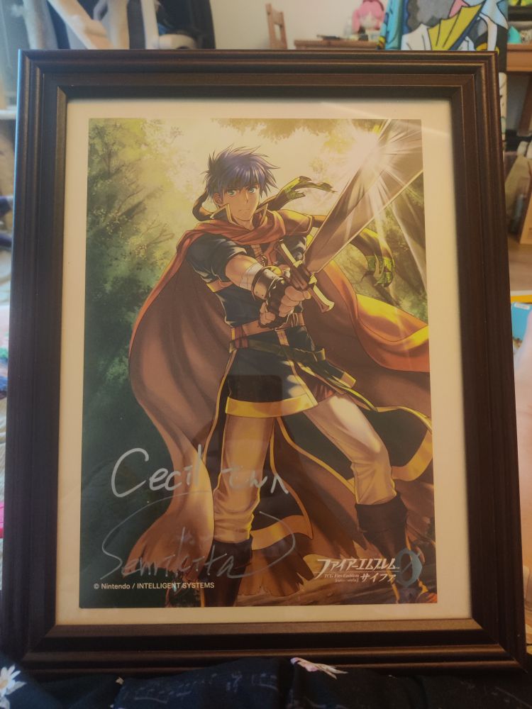 a framed print of ike as he appears in path of radiance, illustrated by senri kita for fire emblem cipher. it is signed by senri kita and addressed to the original poster, cecil