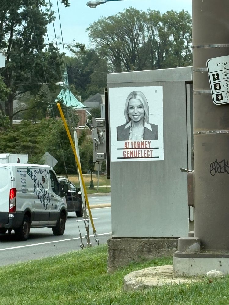 Photo of Pam Bondi with words "Attorney Genuflect"