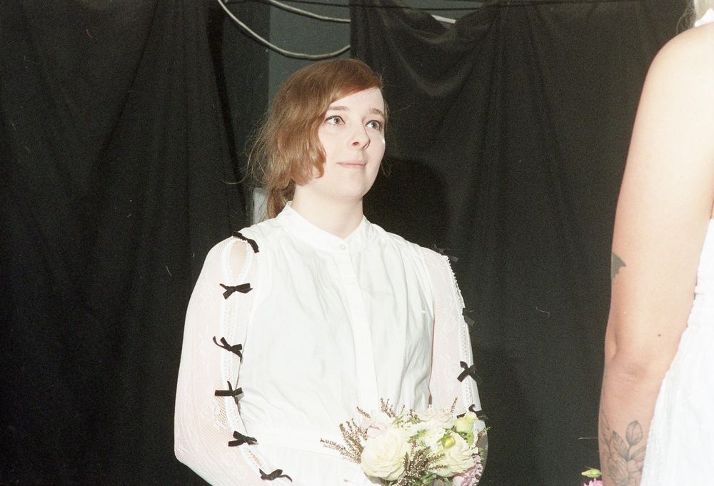 my wife :))) she has a white dress with black bowties and a bouquet