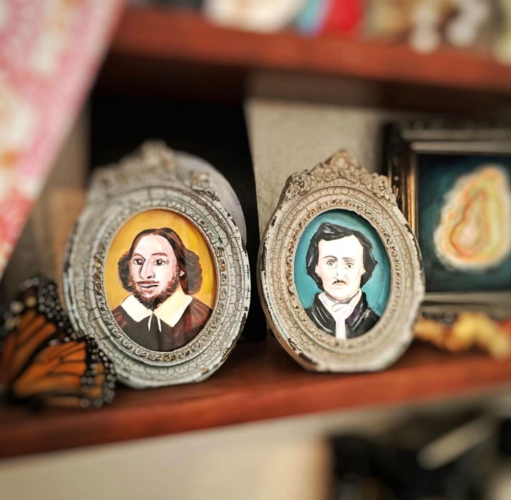 tiny framed illustrations of shakespeare and poe on a bookshelf