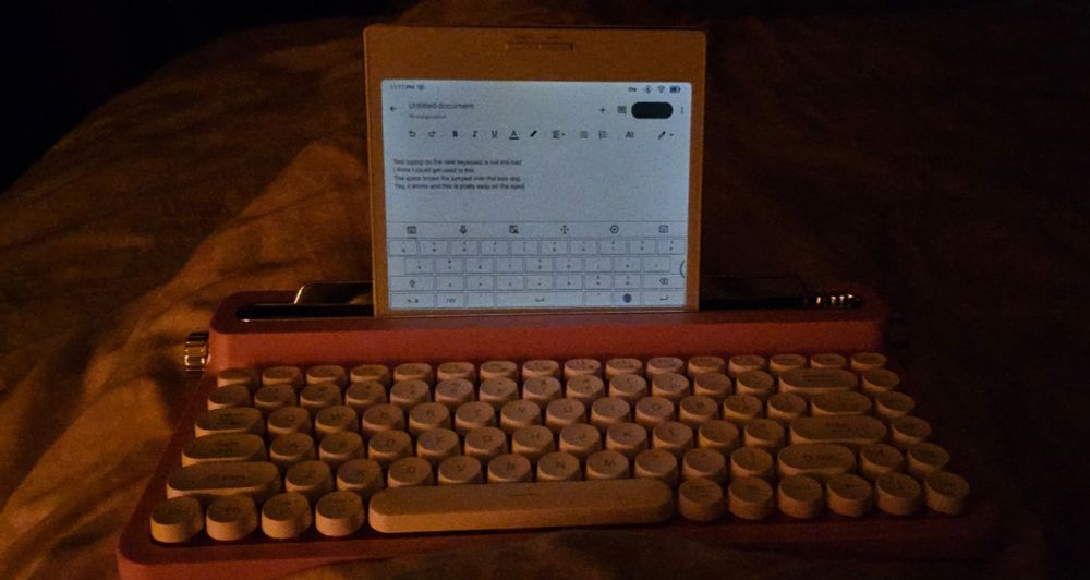 Onyx Boox Go Color 7 eReader & tablet paired with a PrimeConnect BT keyboard on my lap in bed.