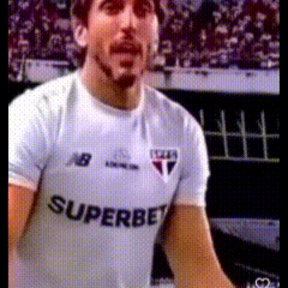 a man with a beard wearing a white shirt that says superbet