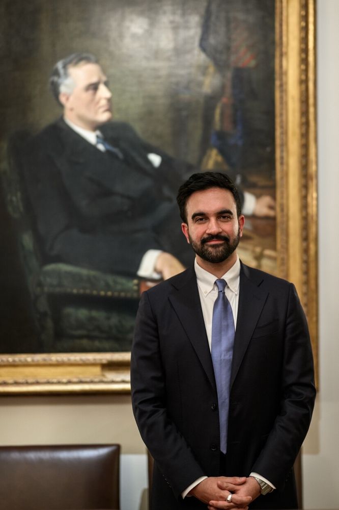 Mamdani in front of FDR portrait