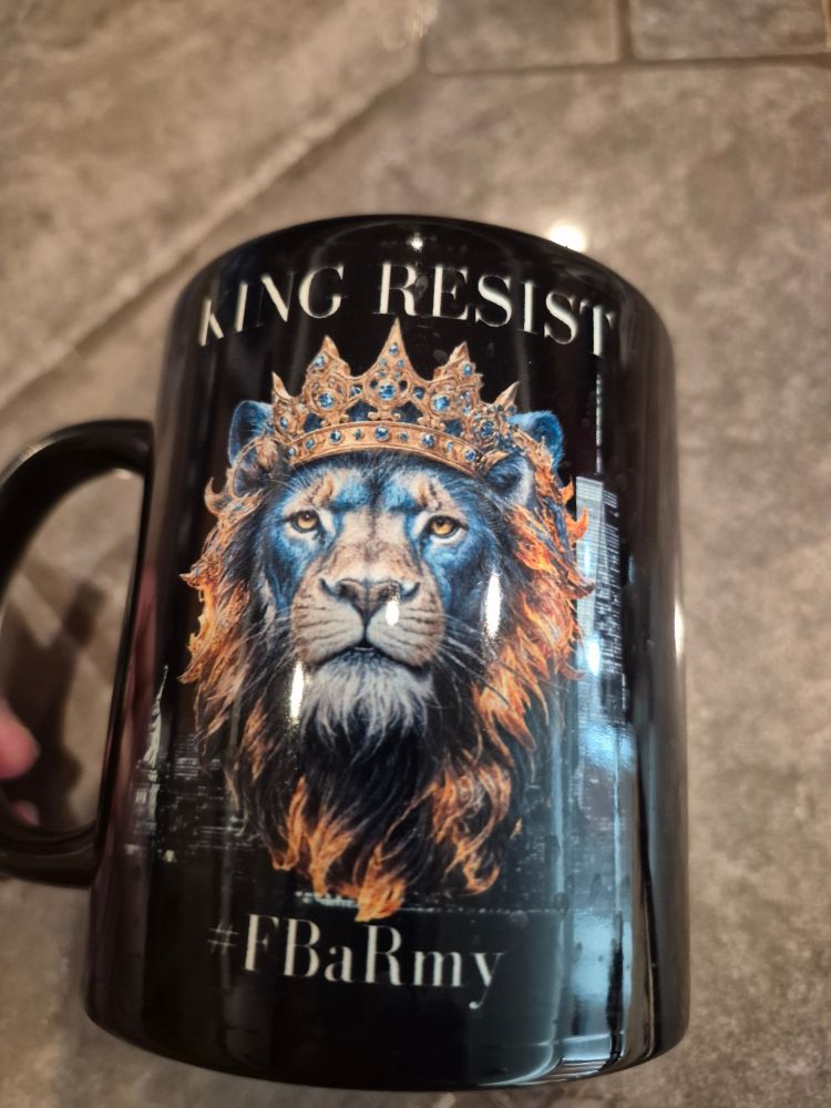 A coffee mug with king resist lion