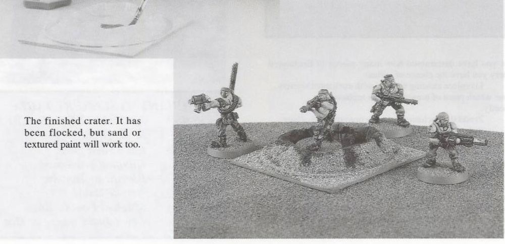 The finished Warhammer 40,000 crater, with the studio Catachan Jungle Fighters defending.