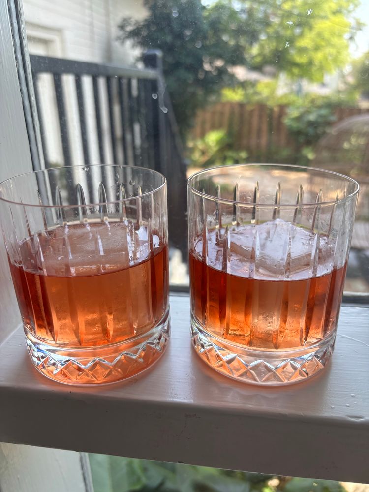 Two pale red cocktails on the rocks 