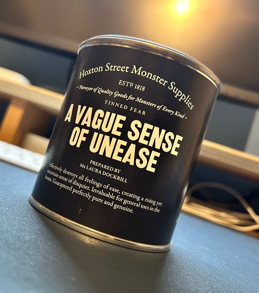 A black tin labelled “A VAGUE SENSE OF UNEASE”