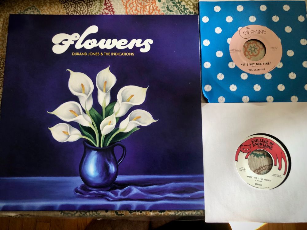 A photo with the new Durand Jones and the Indications record, along with 45s by Brenda and The Charities. Those are two different artists. 