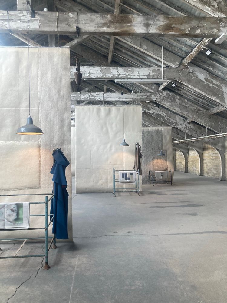 Another part of the factory eaves, this time with some contemporary art installations of hanging furniture, lights, newspapers and cloaks hanging. 